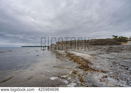 A Beautiful Limestone Formation With A Dramatic Sky In The Background. Picture From The Baltic Sea
