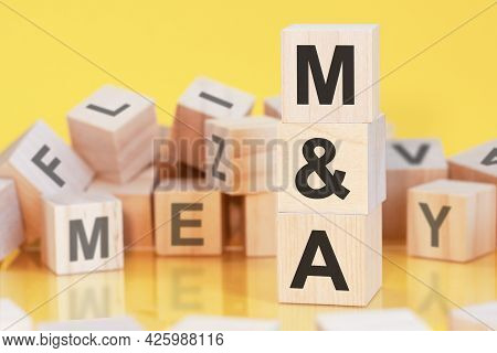 Word M And A From Wooden Blocks With Letters, Concept