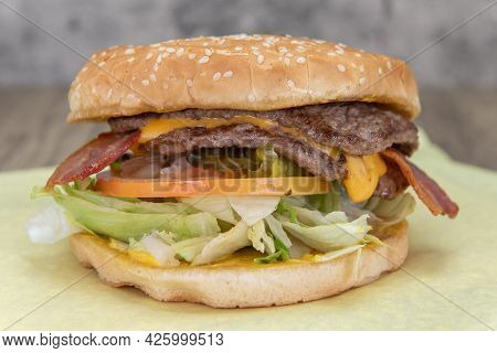 Double Patty Cheeseburger Hamburger Will Fill Any Appetite With Lettuce, Bacon, Tomato, And Sauce Fo