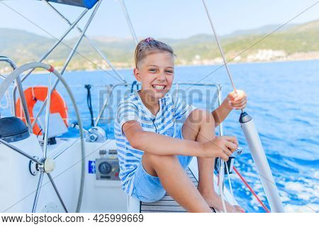 Little Boy On Board Of Sailing Yacht On Summer Cruise. Travel Adventure, Yachting With Child On Fami