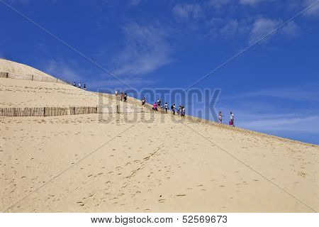 PYLA SUR MER, FRANCE - AUGUST 8: People visiting the Famous dune of Pyla, the highest sand dune in Europe, on August 8, 2012 in Pyla Sur Mer, France.