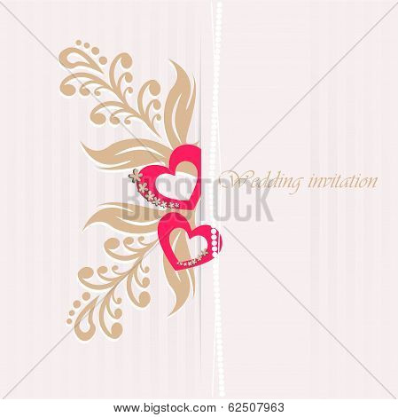 Wedding invitation card with decorative hearts.