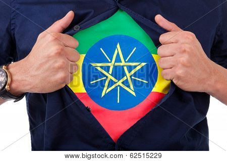 Young Sport Fan Opening His Shirt And Showing The Flag His Country Ethiopia, Ethiopian Flag