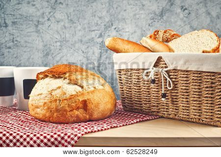 Delicious Bread And Rolls In Wicker Basket