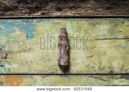 Old Building Tool Plummet On Wood Background