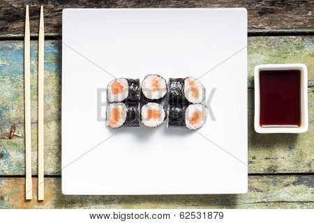 Makisushi On White Plate. Seafood Traditional Maki Sushi Rolls With Chopsticks