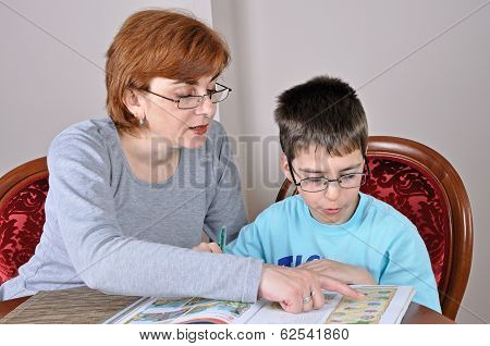 Woman and boy doing homework