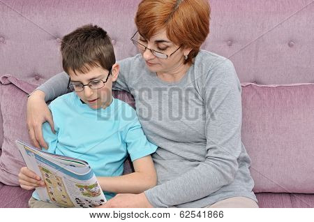 Woman and boy doing homework