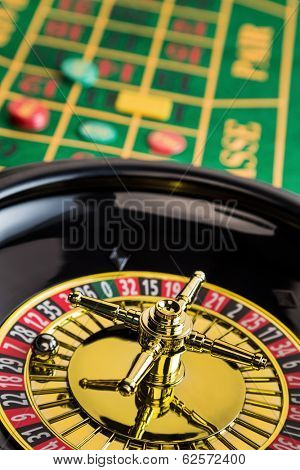 the cylinder of a roulette gambling in a casino. winning or losing is decided by chance.