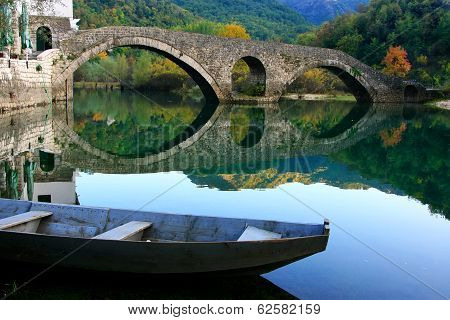 Arched Bridge Reflected In Crnojevica River, Montenegro