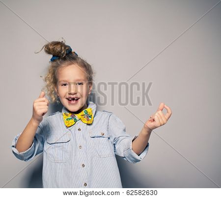 Dansing child. Motions fashion girl studio shot