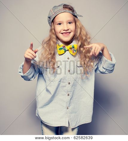 Dansing child. Motions fashion girl studio shot