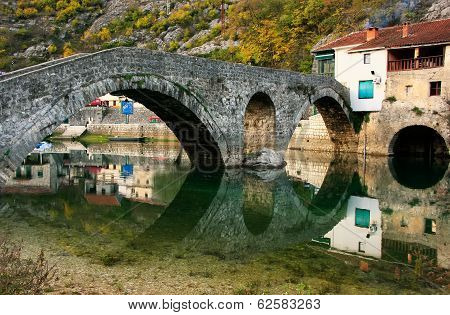 Arched Bridge Reflected In Crnojevica River, Montenegro