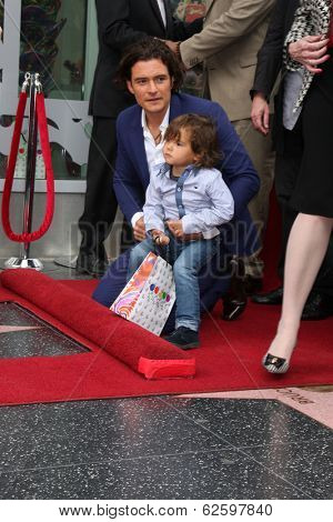 LOS ANGELES - APR 2:  Orlando Bloom, Flynn Bloom at the Orlando Bloom Hollywood Walk of Fame Star Ceremony at TCL Chinese Theater on April 2, 2014 in Los Angeles, CA