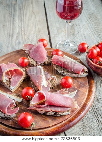 Sandwiches With Italian Ham On The Wooden BoardBoard