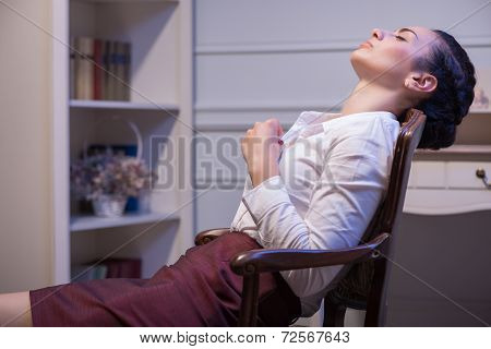 Serious woman wearing white blouse