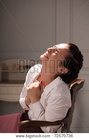 Serious woman wearing white blouse