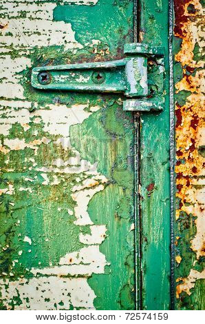 Hinge On Rusty Metal Door With Cracked Paint