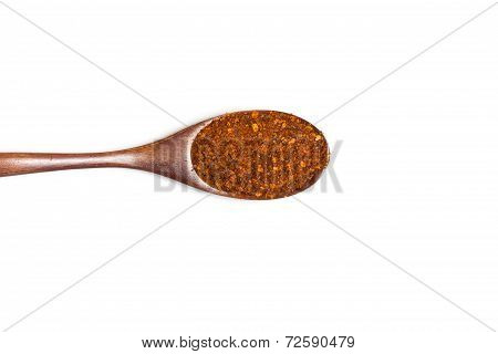 Red Pepper In Spoon On White Background.
