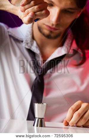 Young Man Bartender Preparing Alcohol Drink