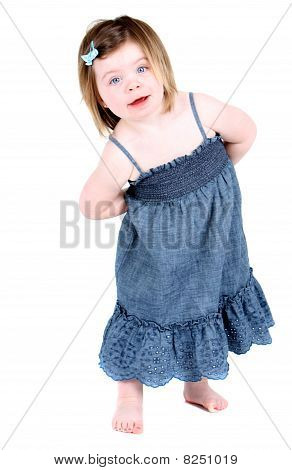 Cute girl with arms folded behind her back