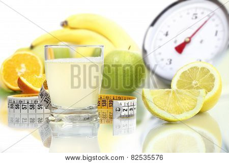 lemon juice poured in glass fruit meter scales diet food