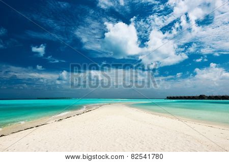Beautiful island beach with sandspit at Maldives