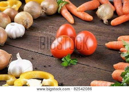 Tomatoes with vegetables mix on the table