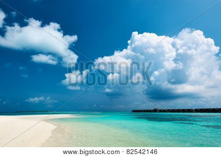 Beautiful island beach with sandspit at Maldives