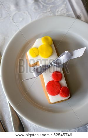 number one shaped birthday cake with baw in white plate