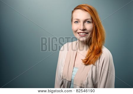 Smiling Red Haired  Woman Looking At Camera