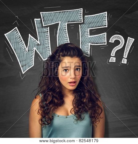 Pretty teenager girl with surprised expression over blackborad with signs