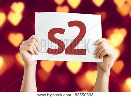 s2 card with heart bokeh background