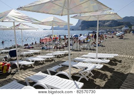 Resting Under A Sun Umbrella On The Beach