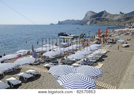 Tourists On The Beach In Sudak In The Crimea
