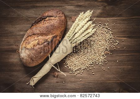 fresh bread and wheat on the wooden
