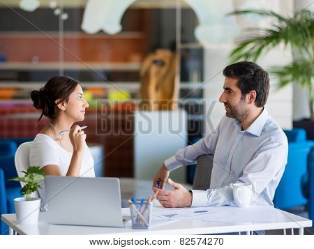 Two collegues working together in an office