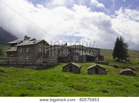 Traditional Stone House In The Valley Floor Of Madesimo, Italy