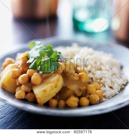 indian vegetarian curry with potatoes, chickpeas and lentils