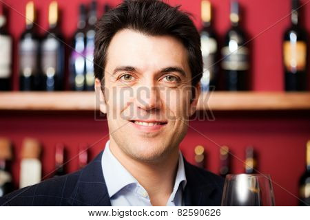 Man satisfied with the quality of the wine that has just tasted