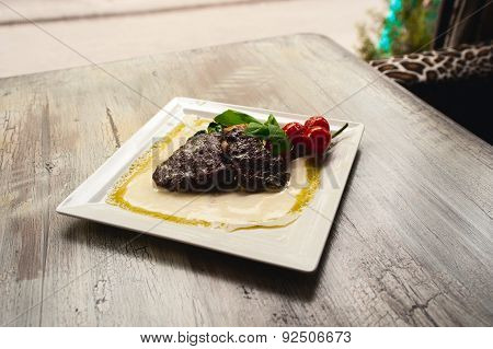 Grilled Beef Steak And Mushrooms With Tomatoes On White Plate