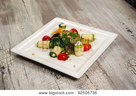 Salad With Cherry Tomatoes, Cucumbers And Meat On White Plate