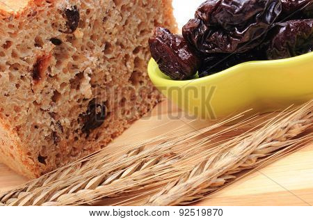Baked Wholemeal Bread, Dried Plums And Ears Of Wheat