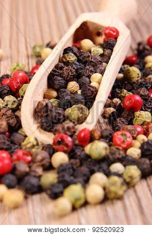 Fresh Colored Pepper With Spoon On Wooden Background