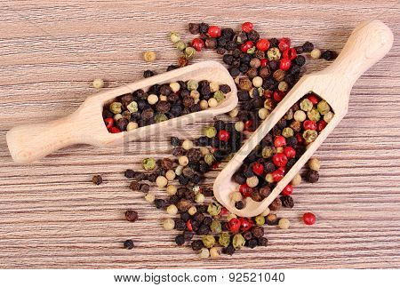 Fresh Colored Pepper With Spoon On Wooden Background