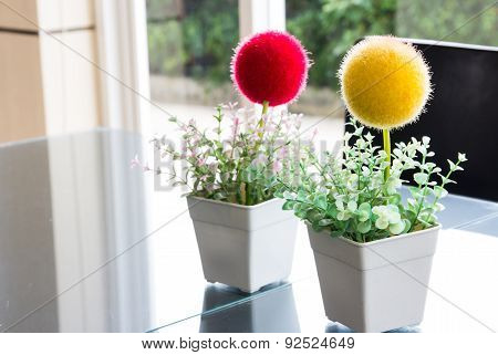 Plastic Flowers On The Table