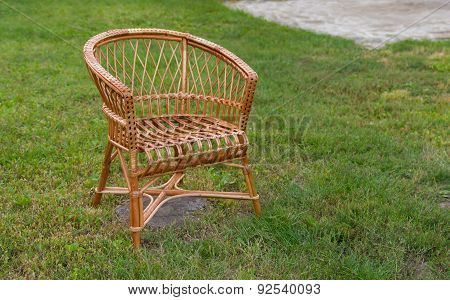 Empty wicker chair in