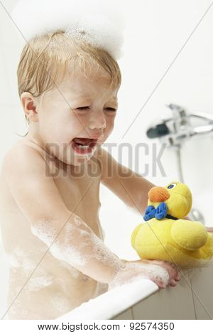 Unhappy Young Girl At Bath Time