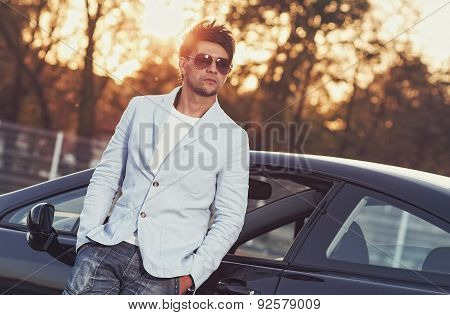 Trendy Handsome Young Man Leaning On His Car. Attractive Gorgeous Guy, Outdoors - Outside