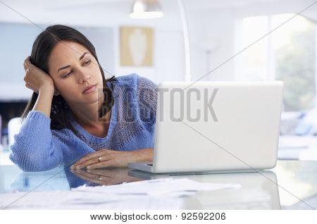 Stressed Woman Working At Laptop In Home Office